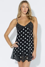 Load image into Gallery viewer, Black and white polka dot mini dress with adjustable spaghetti straps, fitted bodice, ruffle hem, and lightweight flowy fabric for summer.