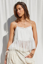 Load image into Gallery viewer, Woman wearing a white lace top and cream pants against a white background