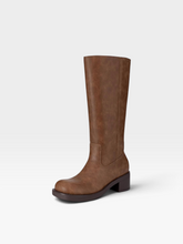 Load image into Gallery viewer, A single mid-calf boot in a distressed brown leather finish, shown from a three-quarter angle against a clean, light gray studio background.