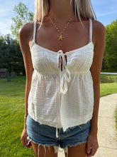 Load image into Gallery viewer, Person wearing a white top and denim shorts outdoors.