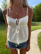 Load image into Gallery viewer, Person wearing a white top and denim shorts outdoors.