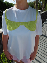 Load image into Gallery viewer, A person wearing a white short sleeve top with an embroidered green and orange bikini top design.