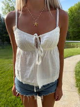 Load image into Gallery viewer, Person wearing a white top and denim shorts outdoors.