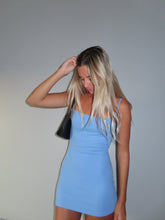 Load image into Gallery viewer, Woman in a blue dress posing against a plain background