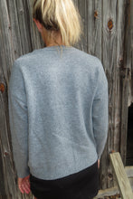 Load image into Gallery viewer, Person wearing a gray sweater on a wooden deck