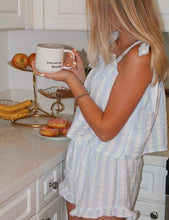 Load image into Gallery viewer, A woman in a white and light blue striped romper stands in a kitchen holding a white ceramic mug that reads 'you are my favorite'.