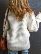 Load image into Gallery viewer, Person wearing a white sweater with a brown leather bag against a dark background