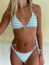 Load image into Gallery viewer, Person wearing a blue and white striped bikini against a neutral background