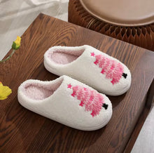 Load image into Gallery viewer, Pair of white slippers with pink floral design on a wooden surface