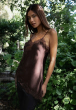 Load image into Gallery viewer, Woman wearing a satin slip in a forest setting