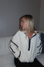 Load image into Gallery viewer, Woman wearing a white outfit with black trim against a plain background