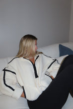 Load image into Gallery viewer, Person wearing a white robe with black trim on a plain background