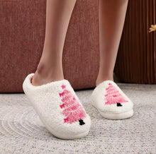 Load image into Gallery viewer, White slippers with pink Christmas tree designs on a textured floor.
