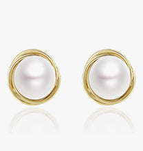 Load image into Gallery viewer, Pearl earrings with gold circular frames on a white background
