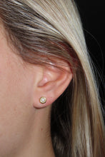 Load image into Gallery viewer, Close-up of an ear with a pearl earring against a dark background
