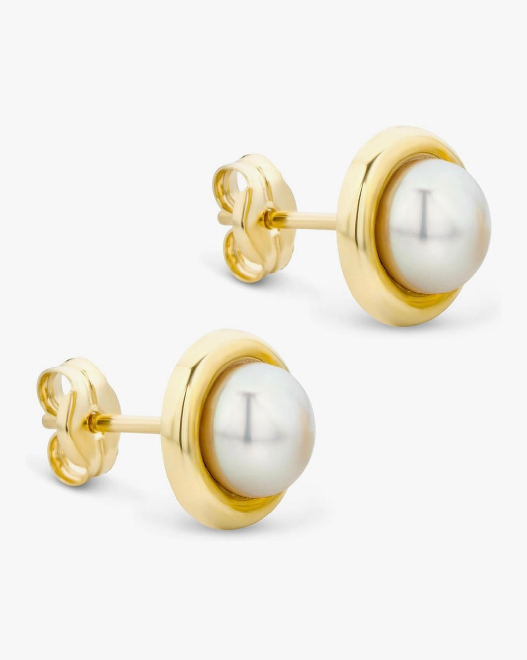 Gold earrings with white pearls on a white background