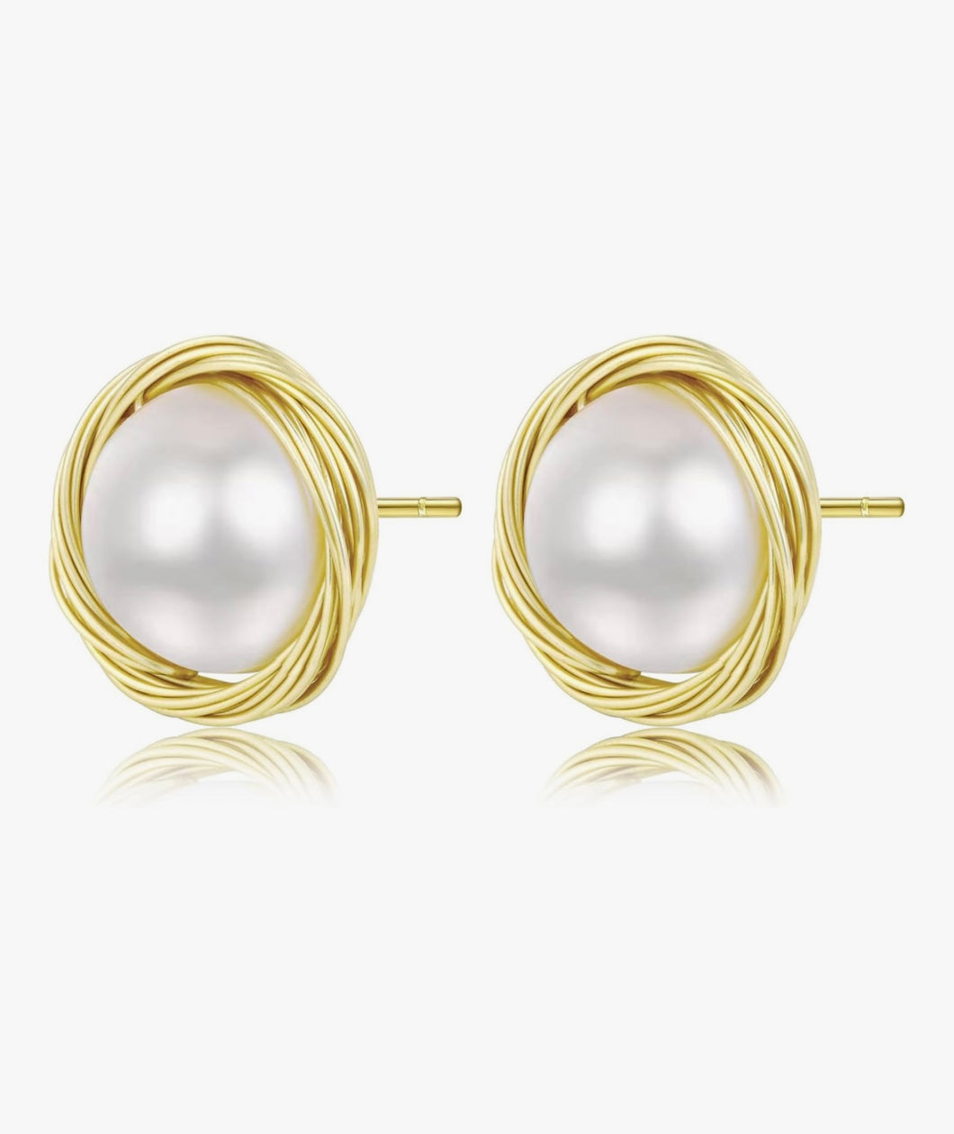 Pair of gold earrings with pearl-like centers on a white background