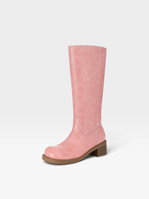 Load image into Gallery viewer, A single knee-high boot in dusty pink faux suede with a brown stacked block heel and sole, shown from a side profile on a light gray background.
