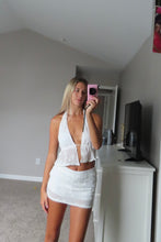 Load image into Gallery viewer, Woman taking a mirror selfie wearing a white lace outfit in a room with a TV and gray walls.

