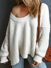 Load image into Gallery viewer, Person wearing a white chunky knit sweater with a brown bag over shoulder against a dark background
