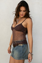Load image into Gallery viewer, Woman wearing a sheer brown top with lace details and a denim skirt against a plain background
