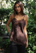 Load image into Gallery viewer, Woman wearing a brown satin slip in a forest setting
