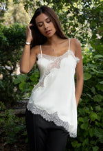 Load image into Gallery viewer, Woman wearing a white lace top and black pants in a forest setting
