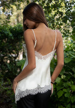 Load image into Gallery viewer, Woman wearing a white lace-trimmed top in a natural setting
