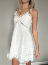 Load image into Gallery viewer, White lace nightgown held by a person against a plain background
