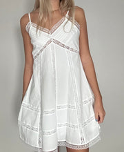 Load image into Gallery viewer, White dress with lace details on a plain background
