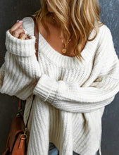 Load image into Gallery viewer, Person wearing a white oversized sweater with a neutral background
