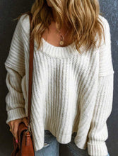 Load image into Gallery viewer, Person wearing a white knitted sweater with a brown leather bag against a dark background
