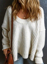 Load image into Gallery viewer, Person wearing a white chunky knit sweater with a dark background

