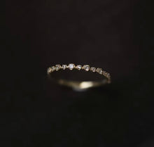 Load image into Gallery viewer, Diamond ring on a dark background
